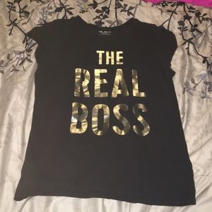 Black tee shirt with gold lettering.